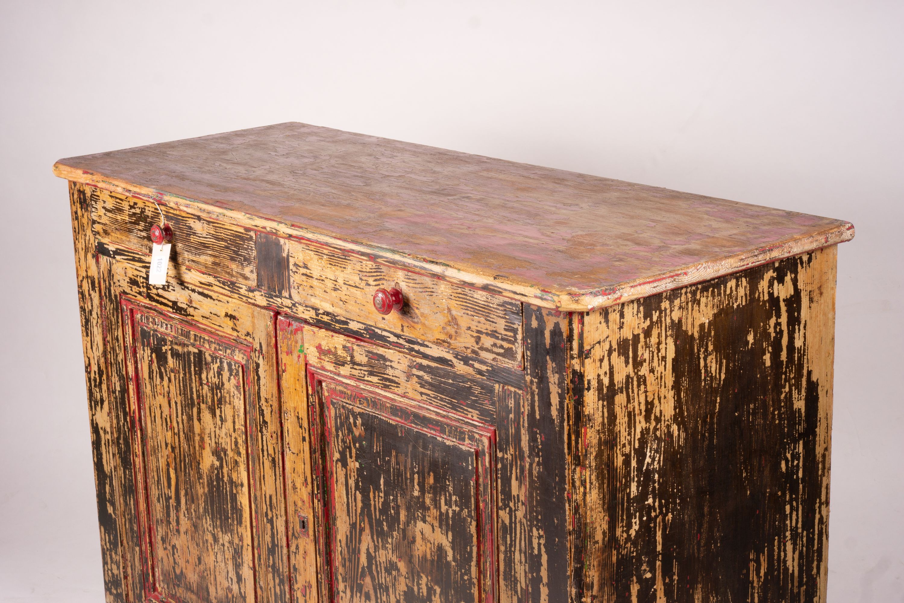 A 19th century French painted pine two door cabinet with scraped finish, width 140cm, depth 57cm, height 105cm